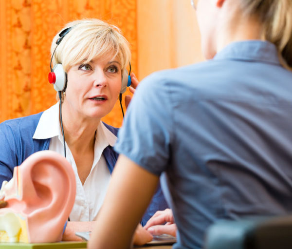 Woman taking hearing test.